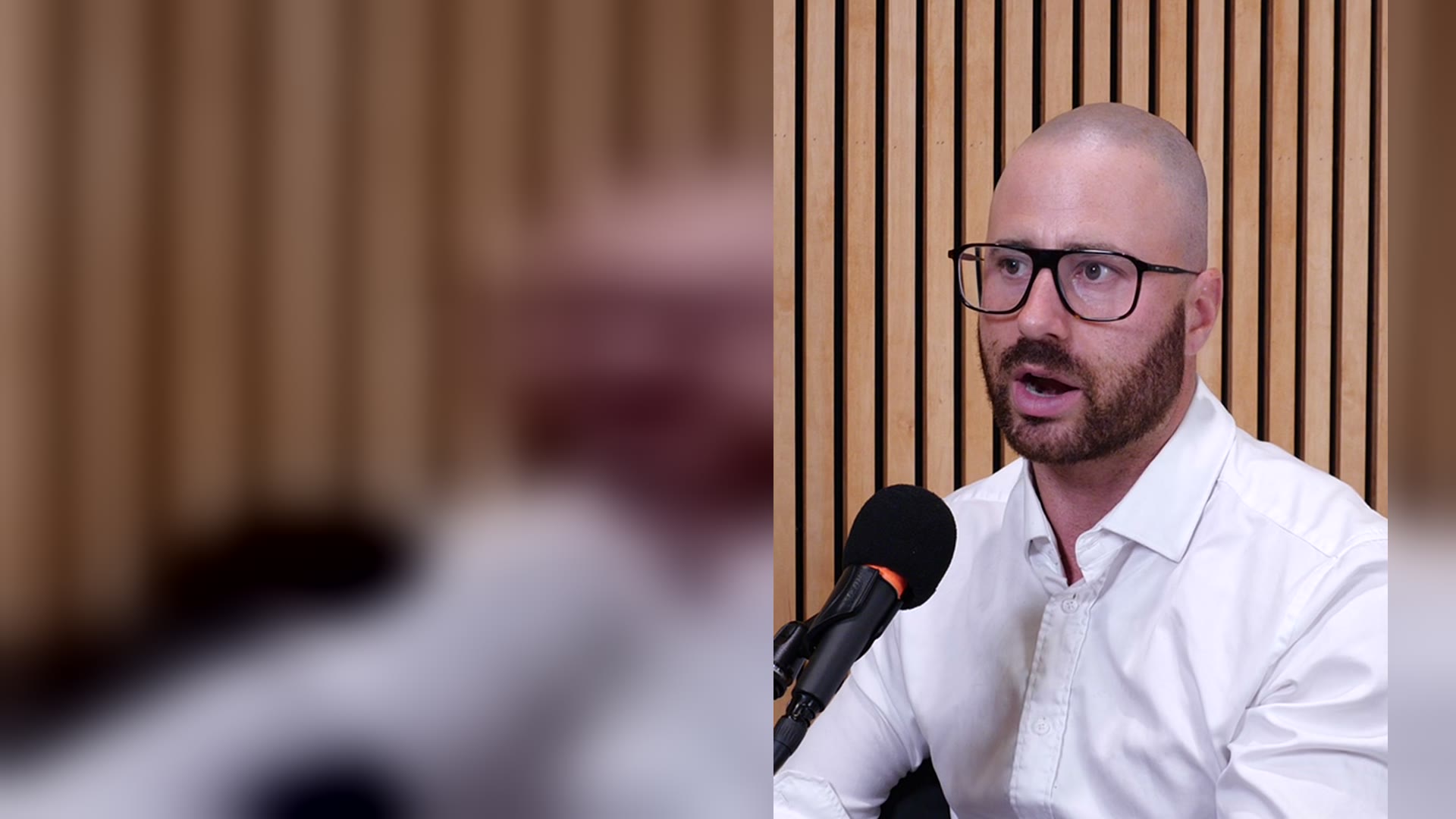 Zachary Poll speaking in the studio