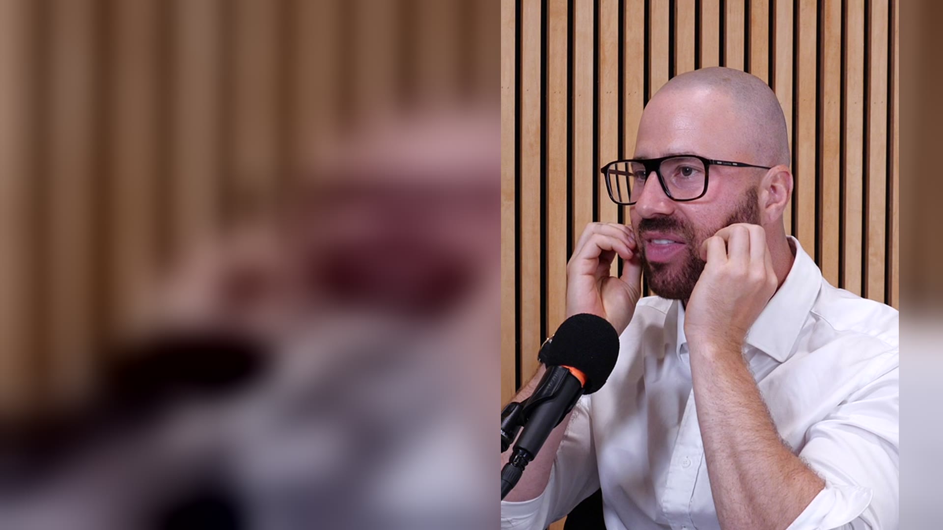 Zachary Poll speaking in the studio